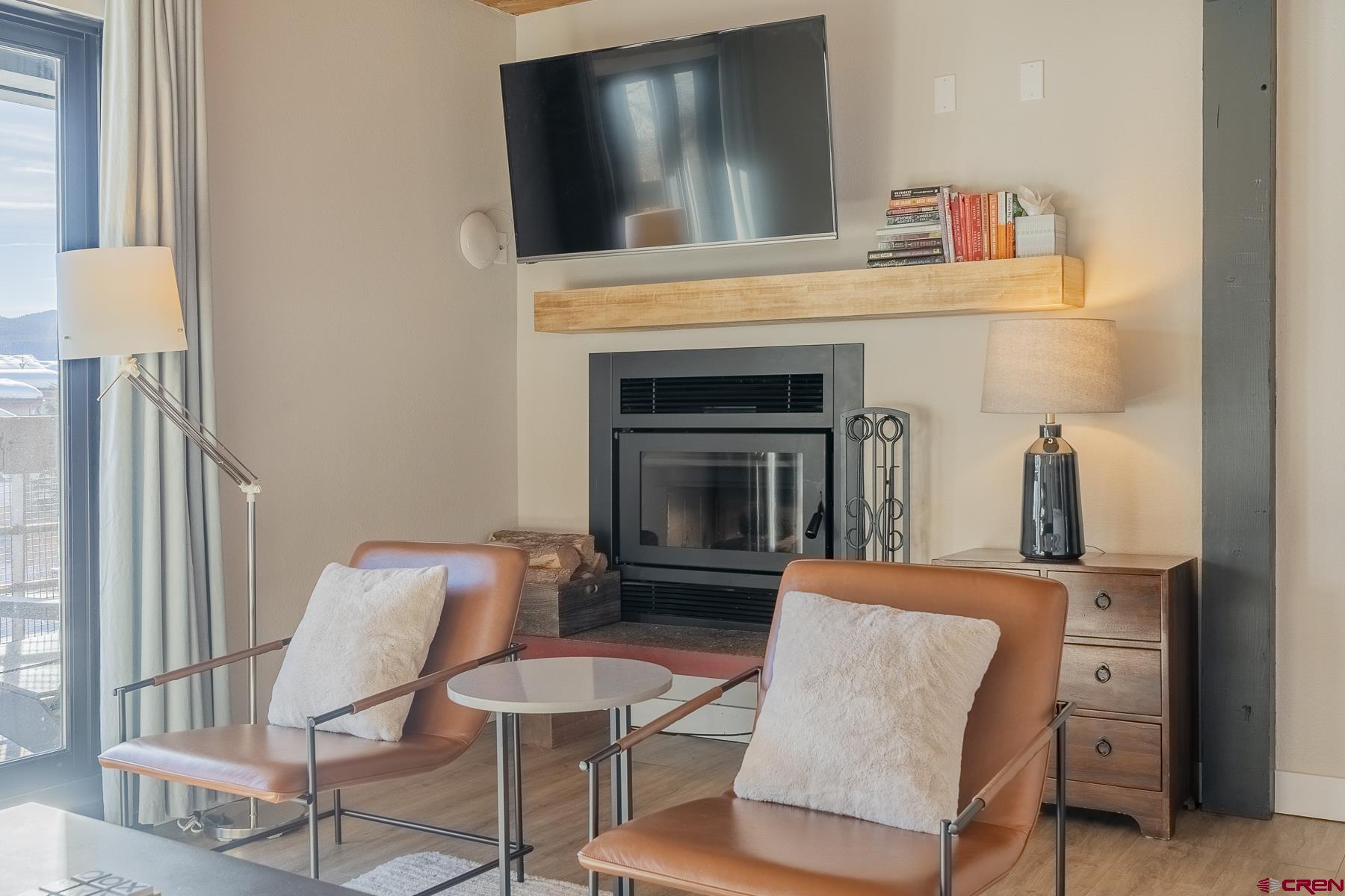 400 Gothic Road, Unit 207 Crested Butte, CO 81225 - Photo 5 of 35 a living room with furniture and a fireplace