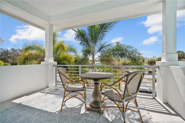 a view of a chairs and table in the patio