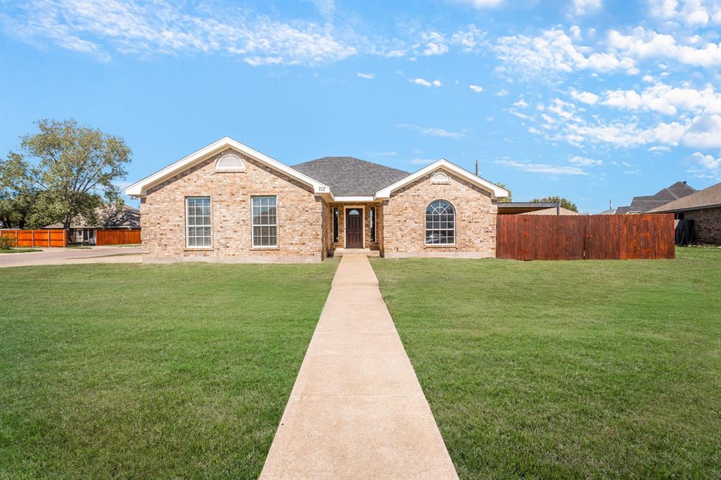 712 Billups Street Van Alstyne, TX 75495 - Photo 1 of 38 a view of a house with a big yard potted plants and large tree