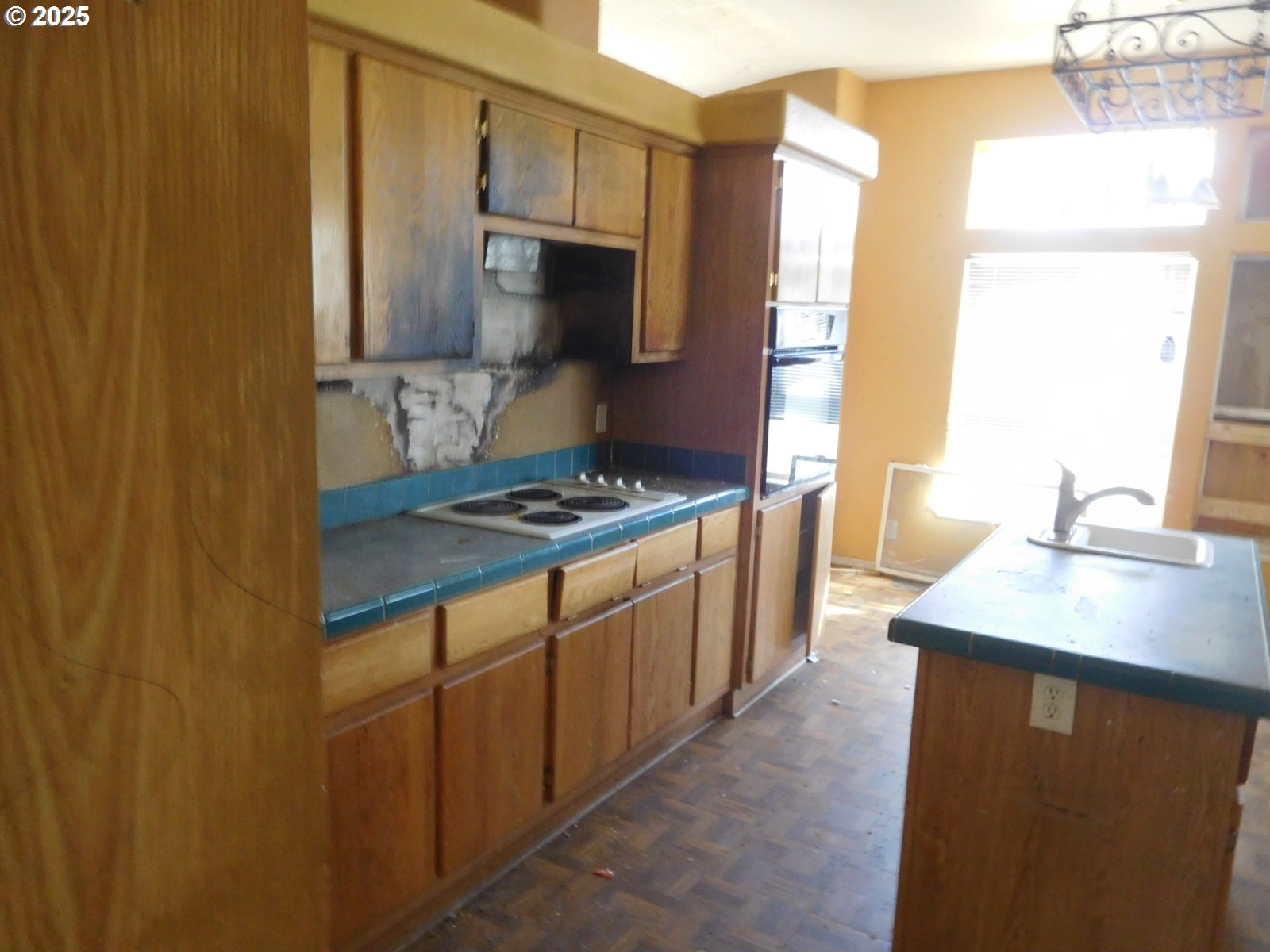 595 South E 13th Irrigon, OR 97844 - Photo 13 of 31 a kitchen with stainless steel appliances a sink stove and a refrigerator