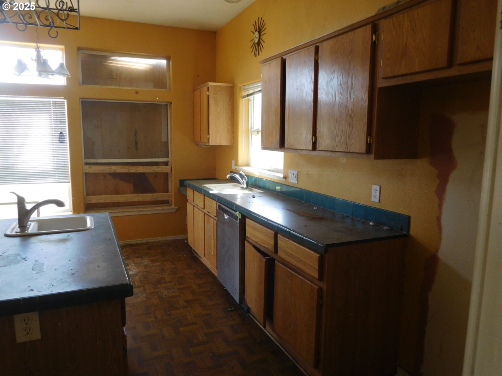 595 South E 13th Irrigon, OR 97844 - Photo 14 of 31 a kitchen with stainless steel appliances granite countertop a sink and a refrigerator