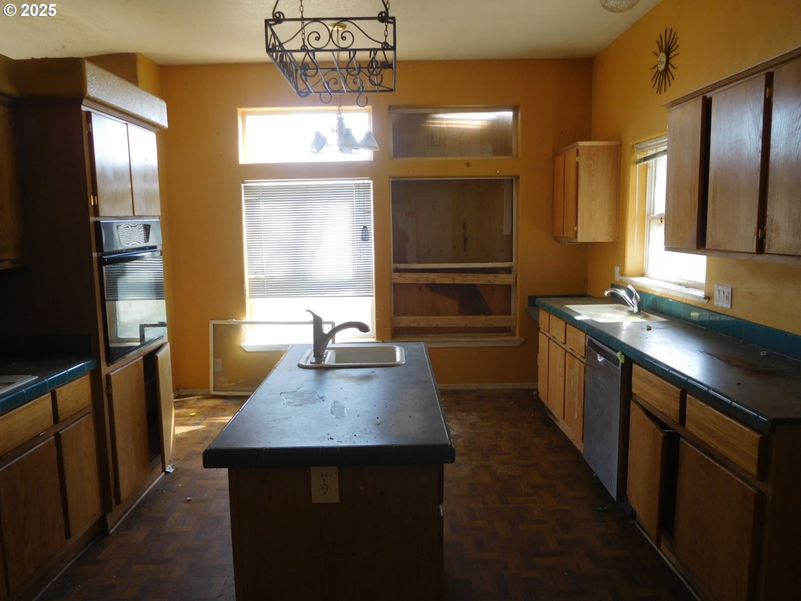 595 South E 13th Irrigon, OR 97844 - Photo 15 of 31 a kitchen with stainless steel appliances a sink stove and refrigerator