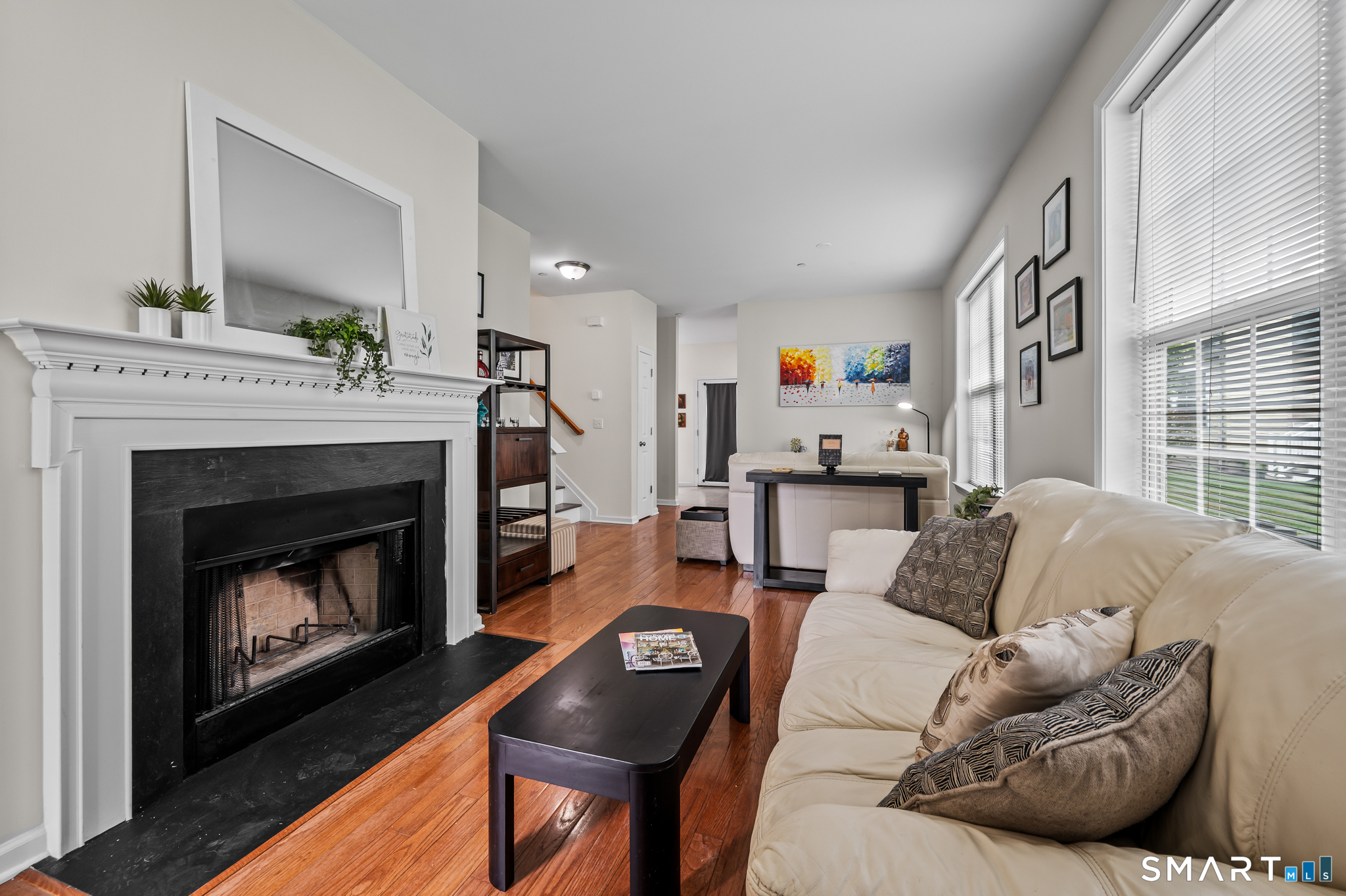 23 Rhodora Terrace, Unit 23 Windsor, CT 06095 - Photo 5 of 36 Living Room with fireplace and hardwood floors