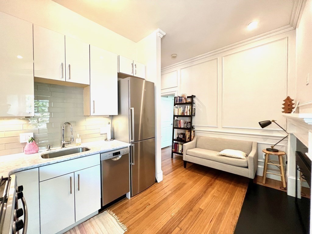11 Garrison Road, Unit 3 Brookline, MA 02445 - Photo 8 of 23 a kitchen with a refrigerator and a sink