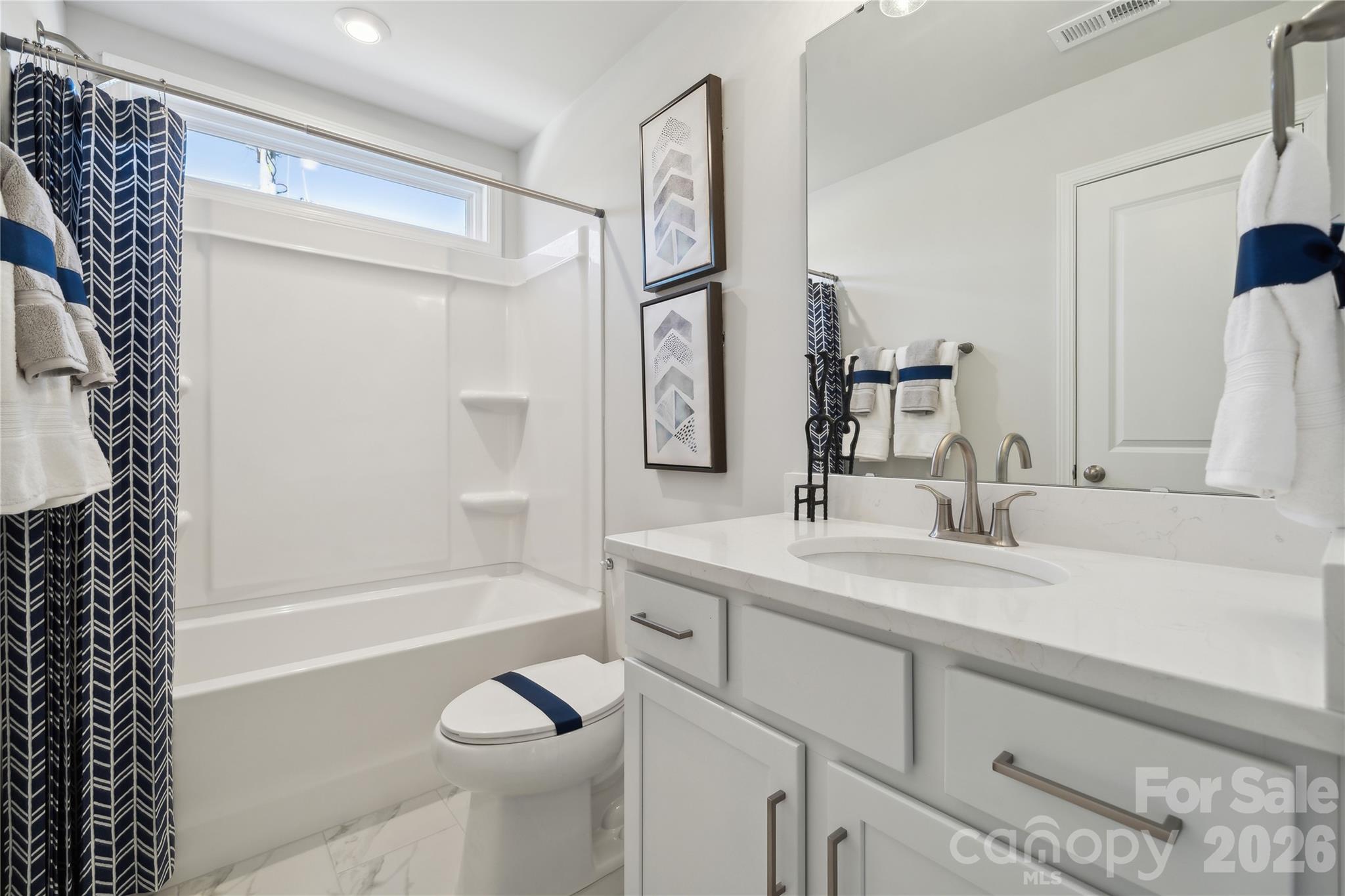 108 Coronado Avenue Matthews, NC 28104 - Photo 14 of 38 a bathroom with a granite countertop sink toilet and shower