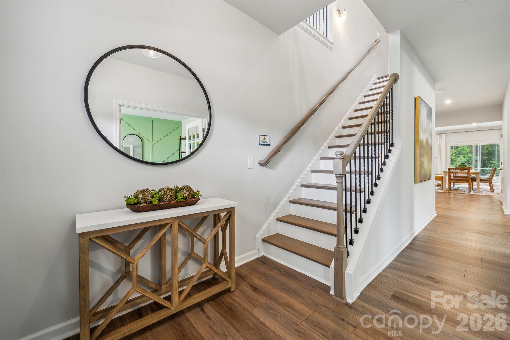 108 Coronado Avenue Matthews, NC 28104 - Photo 17 of 38 an entryway with wooden floor and windows