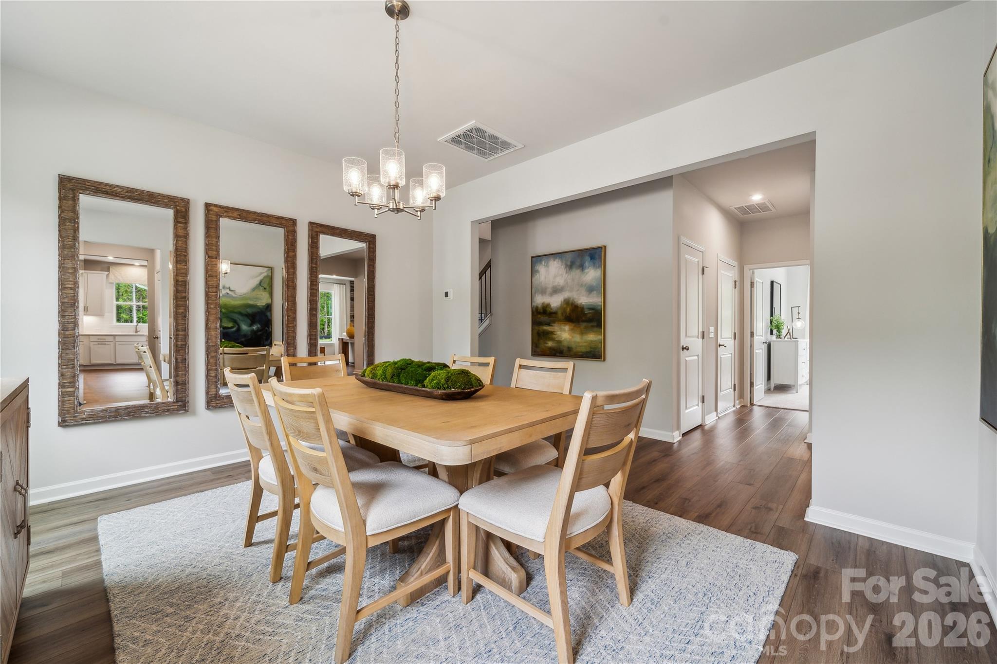 108 Coronado Avenue Matthews, NC 28104 - Photo 22 of 38 a view of a dining room with furniture and wooden floor