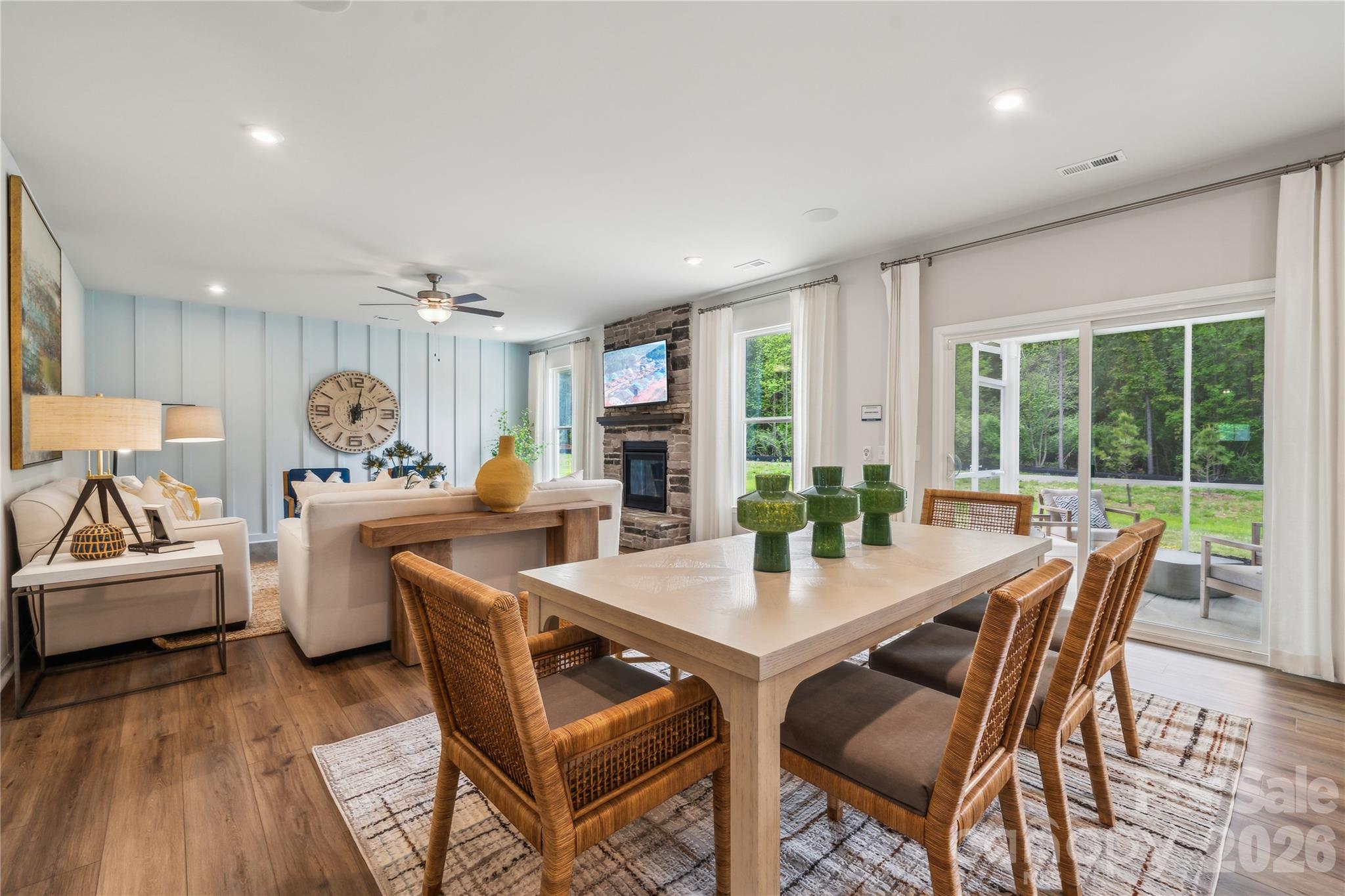 108 Coronado Avenue Matthews, NC 28104 - Photo 24 of 38 a dining room with furniture a rug and wooden floor