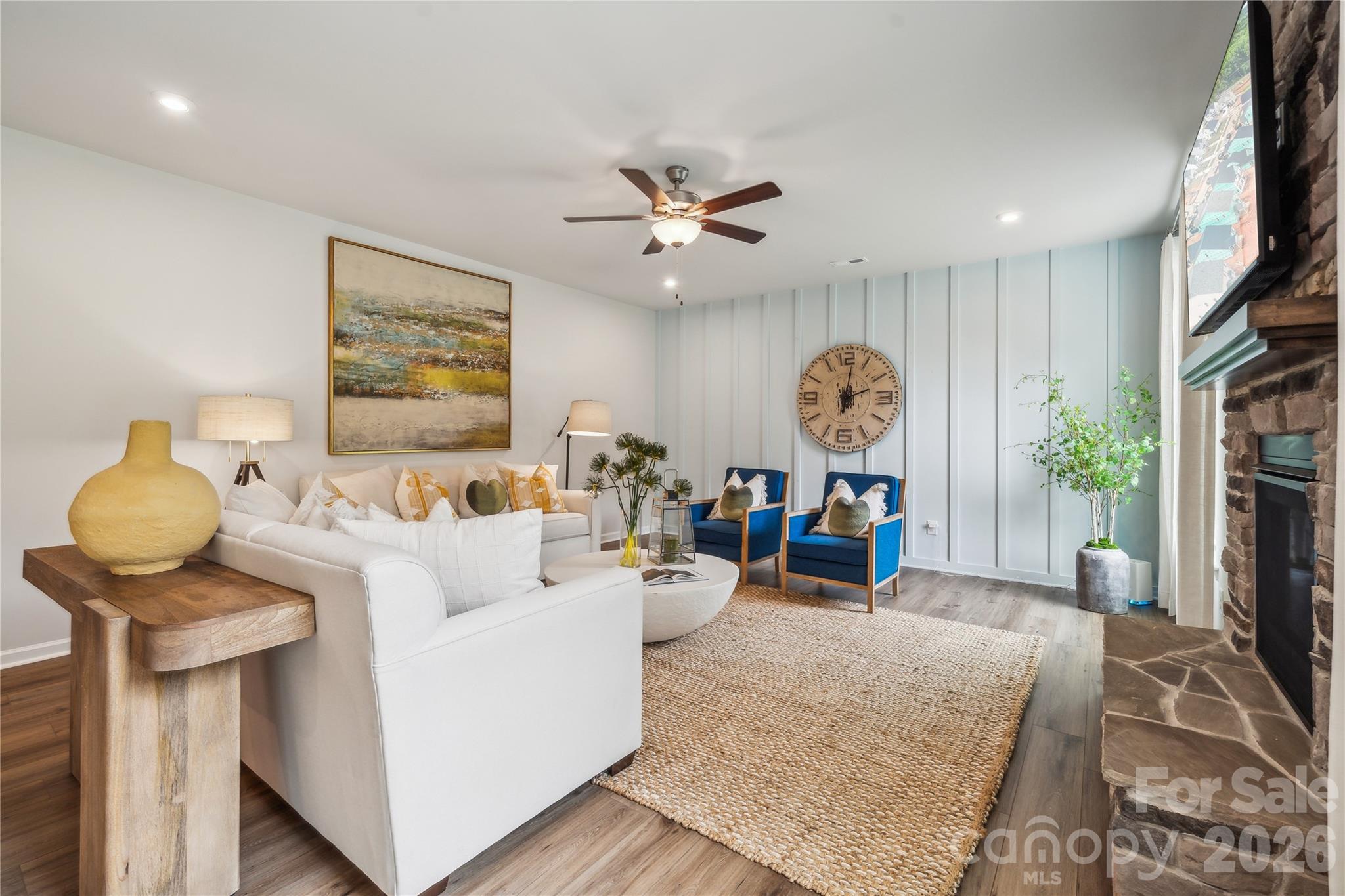 108 Coronado Avenue Matthews, NC 28104 - Photo 29 of 38 a living room with furniture a clock and a large mirror