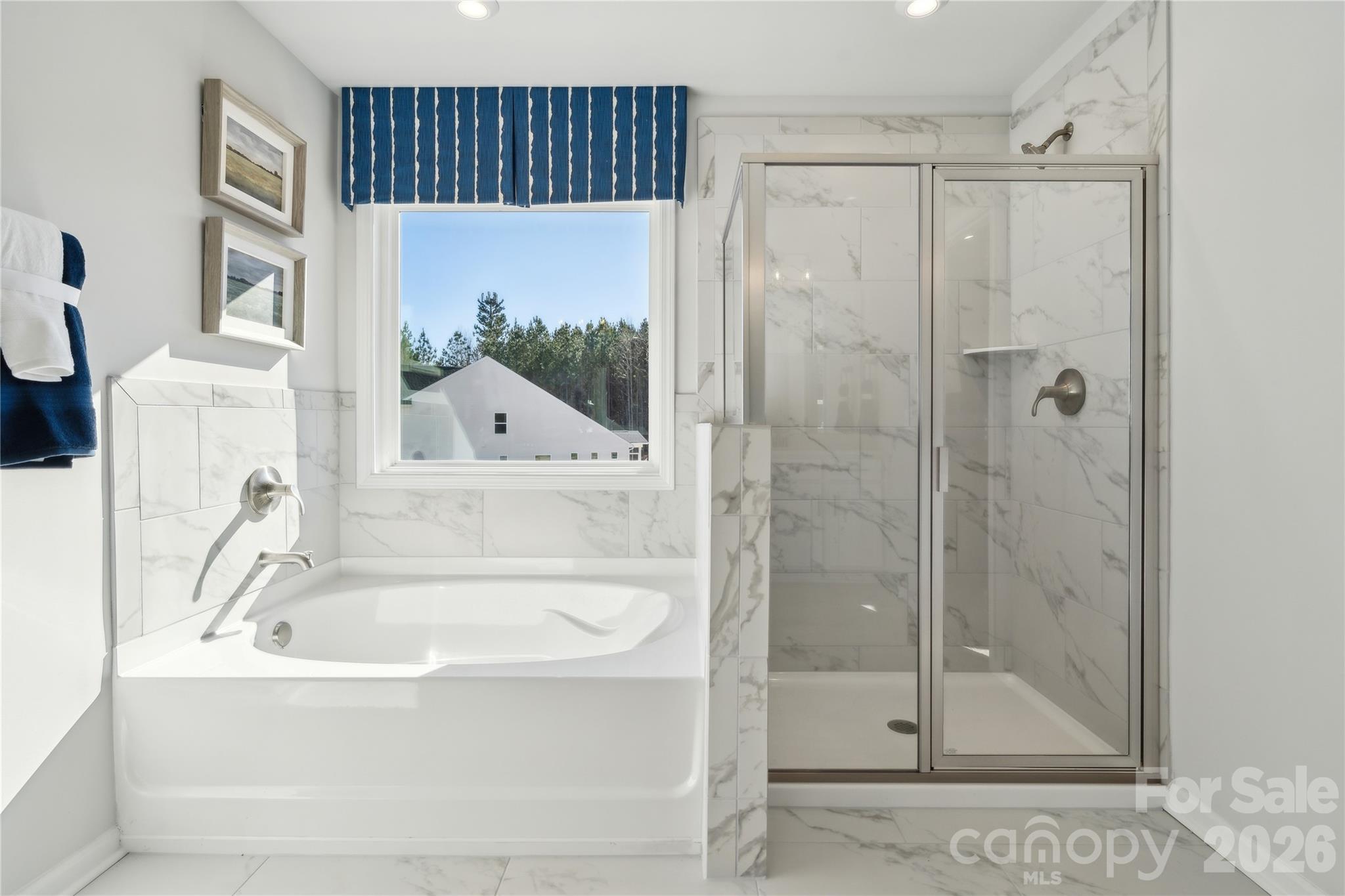 108 Coronado Avenue Matthews, NC 28104 - Photo 6 of 38 a bathroom with a bathtub and a shower