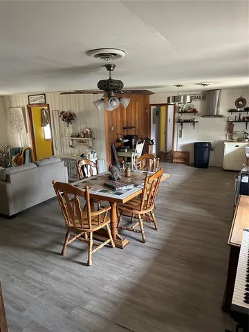 a bathroom with a sink a toilet a window and a shower