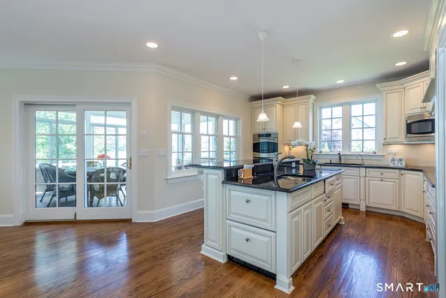 a bedroom with a bed and a chair