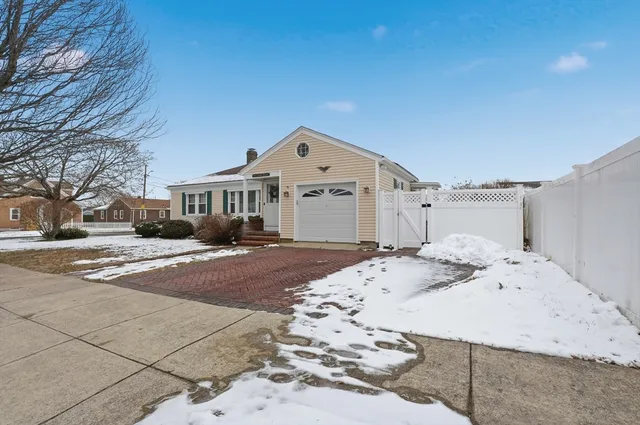 a front view of a house with a snow in front of house