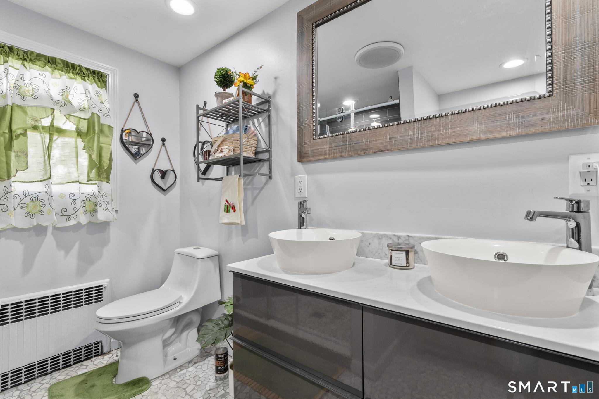 208 Bungay Road Seymour, CT 06483 - Photo 11 of 24 a bathroom with a toilet sink and mirror