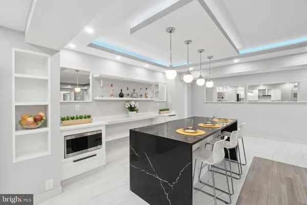 a kitchen with stainless steel appliances granite countertop a stove and a refrigerator