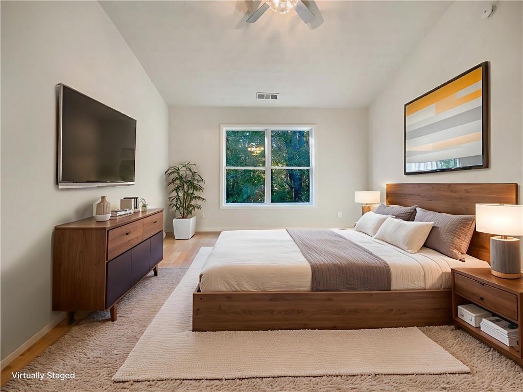 11569 Kades Trail Hampton, GA 30228 - Photo 13 of 25 a bedroom with a large bed and a flat screen tv