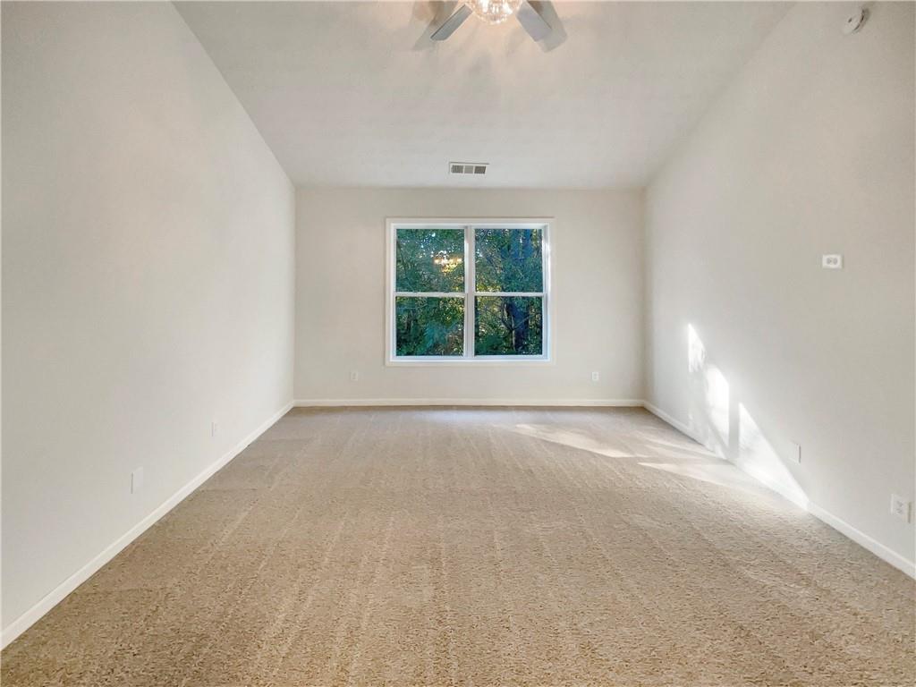 11569 Kades Trail Hampton, GA 30228 - Photo 14 of 25 an empty room with a window