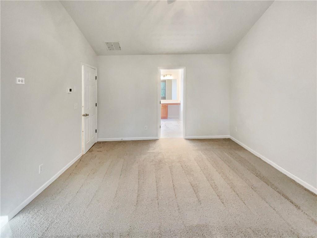 11569 Kades Trail Hampton, GA 30228 - Photo 15 of 25 a view of a room with wooden floor and window