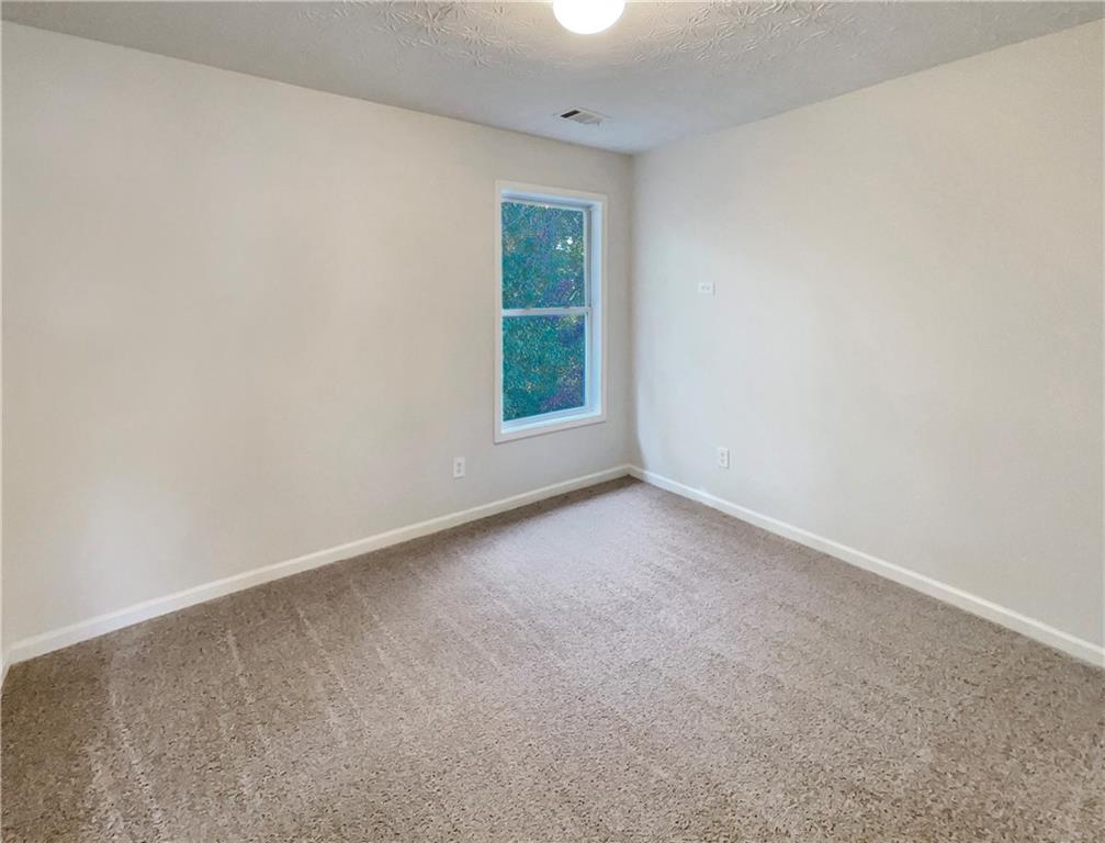 11569 Kades Trail Hampton, GA 30228 - Photo 16 of 25 an empty room with a window
