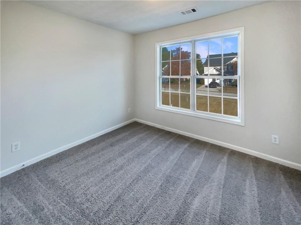 11569 Kades Trail Hampton, GA 30228 - Photo 17 of 25 an empty room with a window