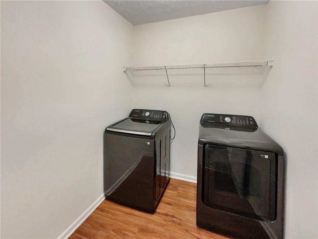 11569 Kades Trail Hampton, GA 30228 - Photo 18 of 25 a utility room with dryer and washer