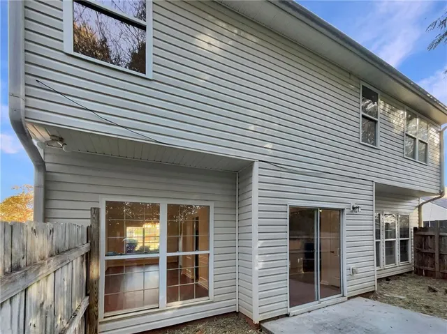 a view of a house that has a large window