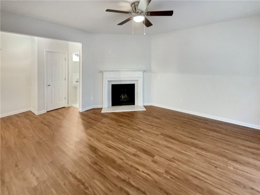 11569 Kades Trail Hampton, GA 30228 - Photo 4 of 25 a view of empty room with wooden floor and fan