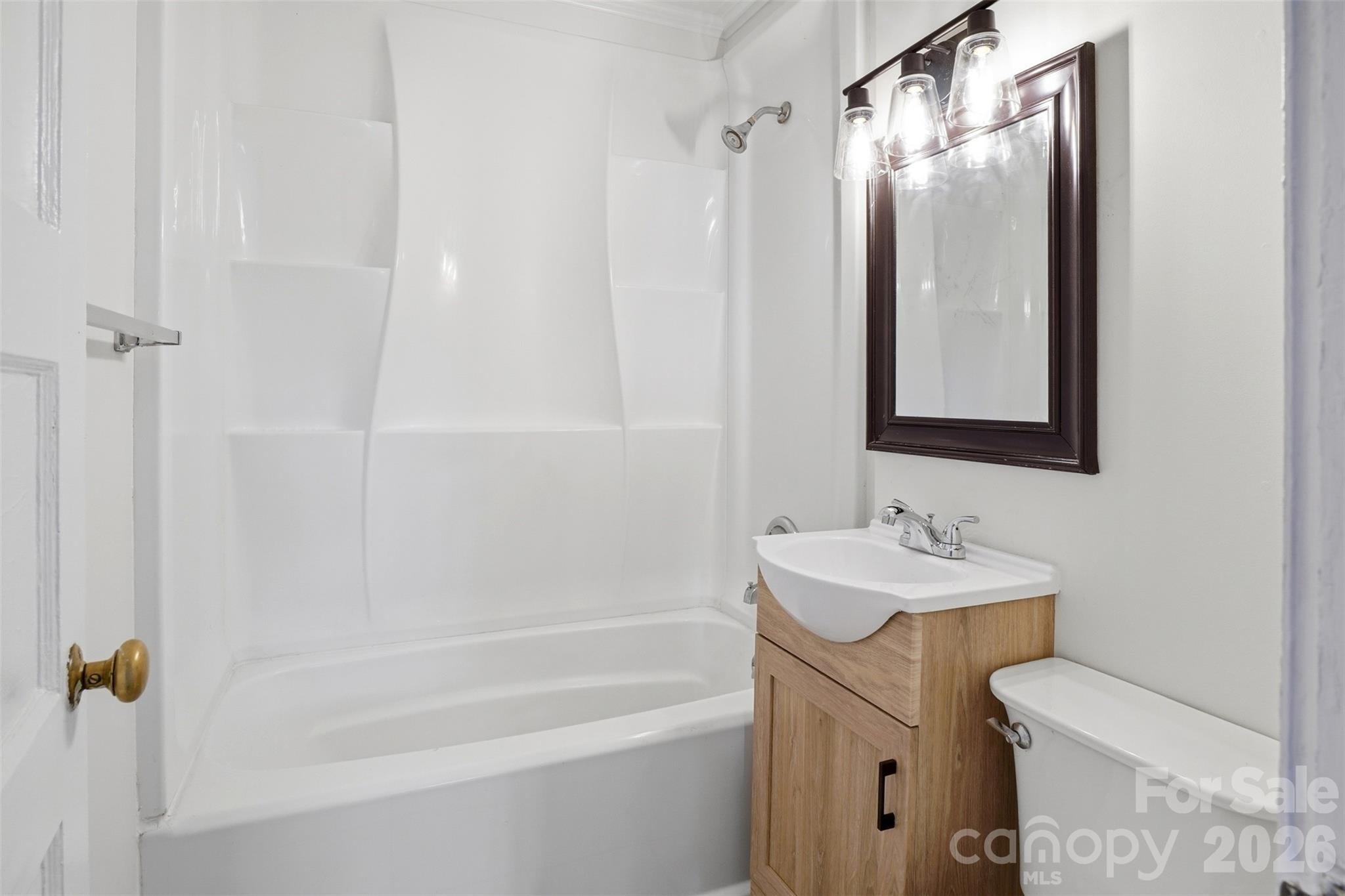 128 Ella Street Chester, SC 29706 - Photo 8 of 18 a bathroom with a sink a toilet and shower