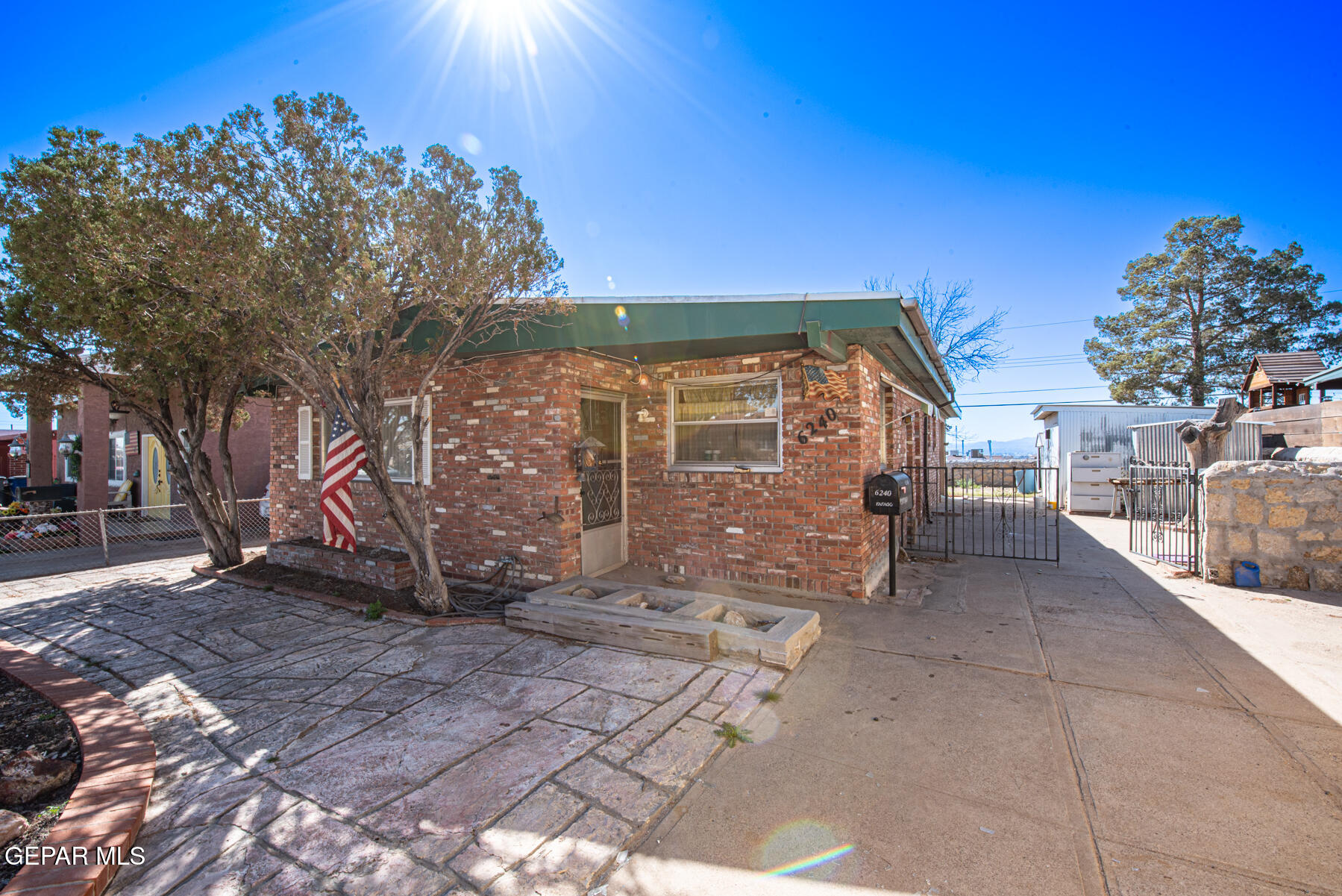 6240 Papago Road El Paso, TX 79905 - Photo 3 of 12 a view of a house with a backyard