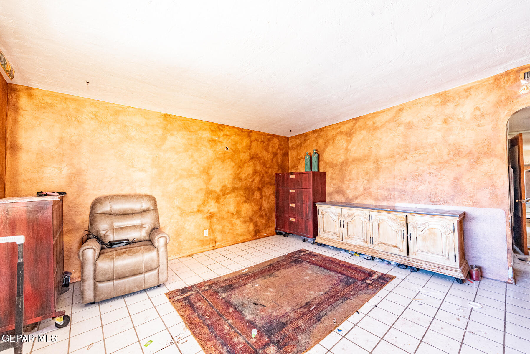6240 Papago Road El Paso, TX 79905 - Photo 4 of 12 a view of a bedroom with furniture and a window