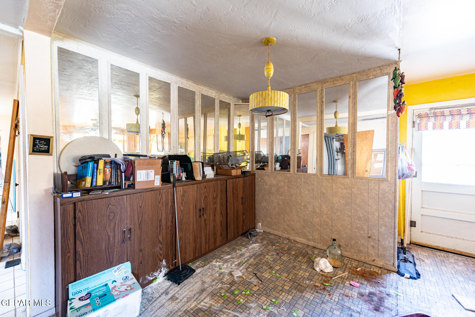 6240 Papago Road El Paso, TX 79905 - Photo 6 of 12 a open kitchen with stainless steel appliances kitchen island granite countertop a refrigerator and a stove