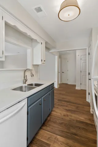 a kitchen with a sink and a stove