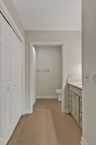 a bathroom with a sink a mirror and vanity