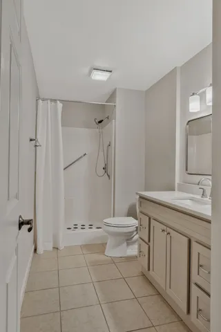 a bathroom with a sink vanity and a mirror