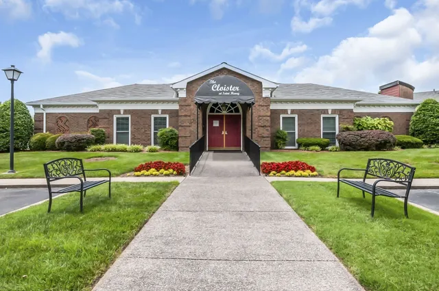 a view of a swimming pool with an outdoor seating