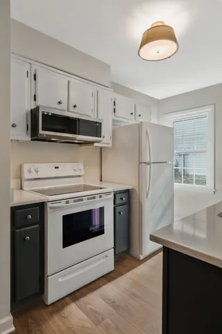 a kitchen with stainless steel appliances a stove a refrigerator and a sink