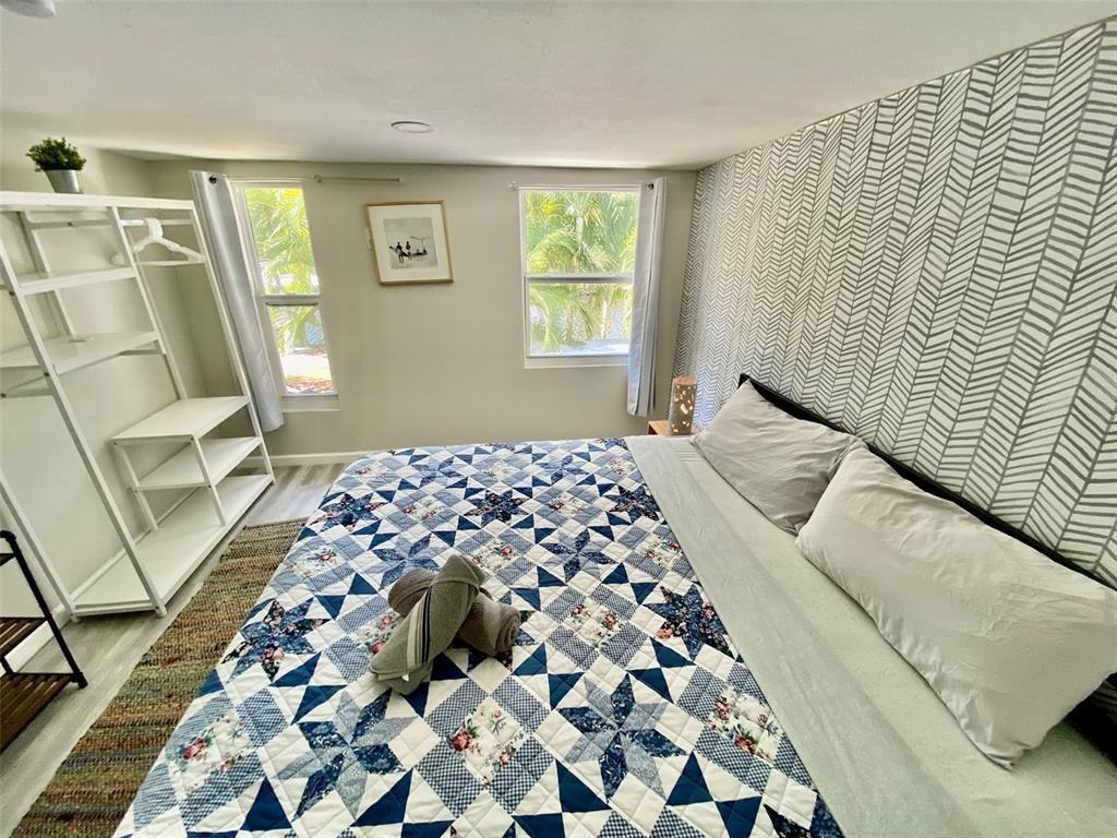 1310 Northeast 30th Street, Unit 4 Fort Lauderdale, FL 33334 - Photo 14 of 24 a bedroom with a bed and a window