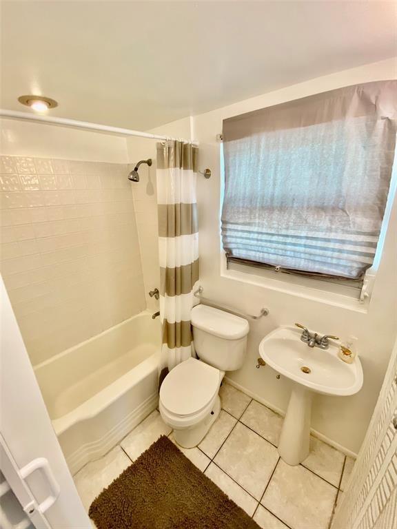 1310 Northeast 30th Street, Unit 4 Fort Lauderdale, FL 33334 - Photo 17 of 24 a bathroom with a sink a toilet and bathtub