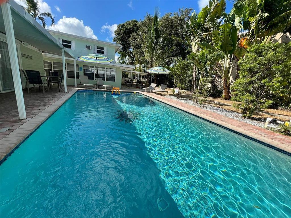 1310 Northeast 30th Street, Unit 4 Fort Lauderdale, FL 33334 - Photo 19 of 24 a view of a house with a yard