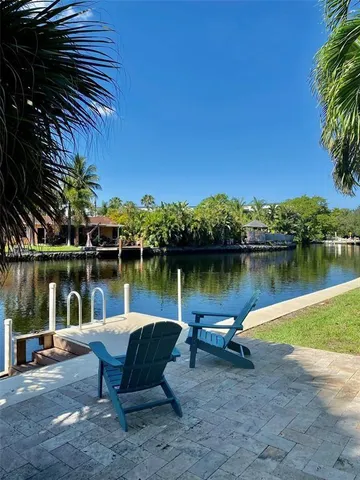 a lake view with a bench next to a lake