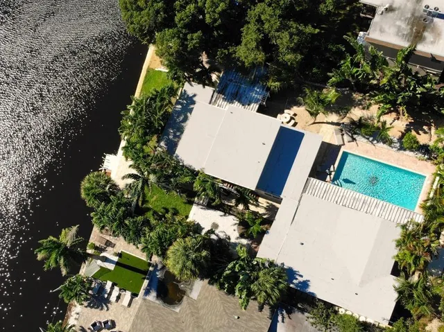 an aerial view of a house with a yard and garden