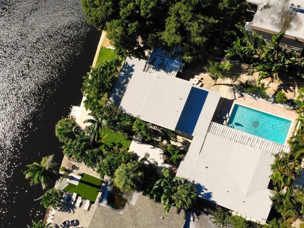 1310 Northeast 30th Street, Unit 4 Fort Lauderdale, FL 33334 - Photo 2 of 24 an aerial view of a house with a yard and garden