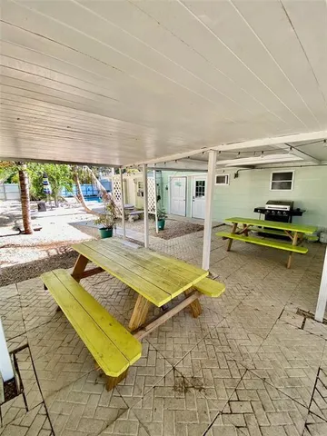 a view of a swimming pool and lounge chair