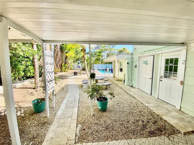 a lobby with furniture and a potted plant