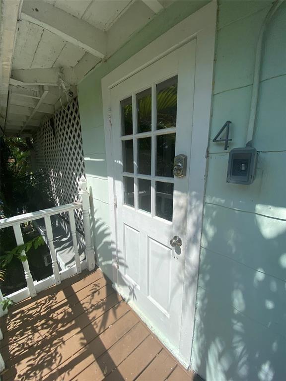 1310 Northeast 30th Street, Unit 4 Fort Lauderdale, FL 33334 - Photo 3 of 24 a view of balcony with wooden floor and seating space