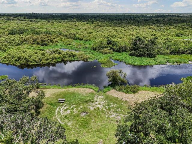 a view of a garden with an outdoor space
