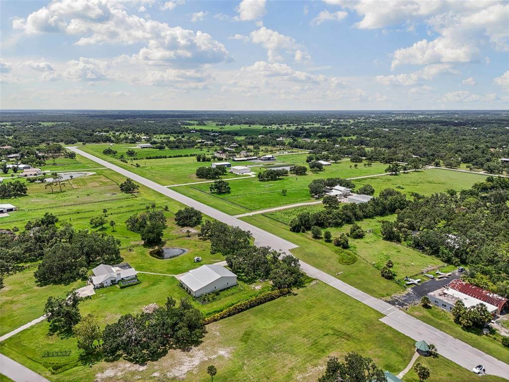 0 Hidden River Road Sarasota, FL 34240 - Photo 5 of 18 an aerial view of a city with lots of residential buildings and mountain view in back