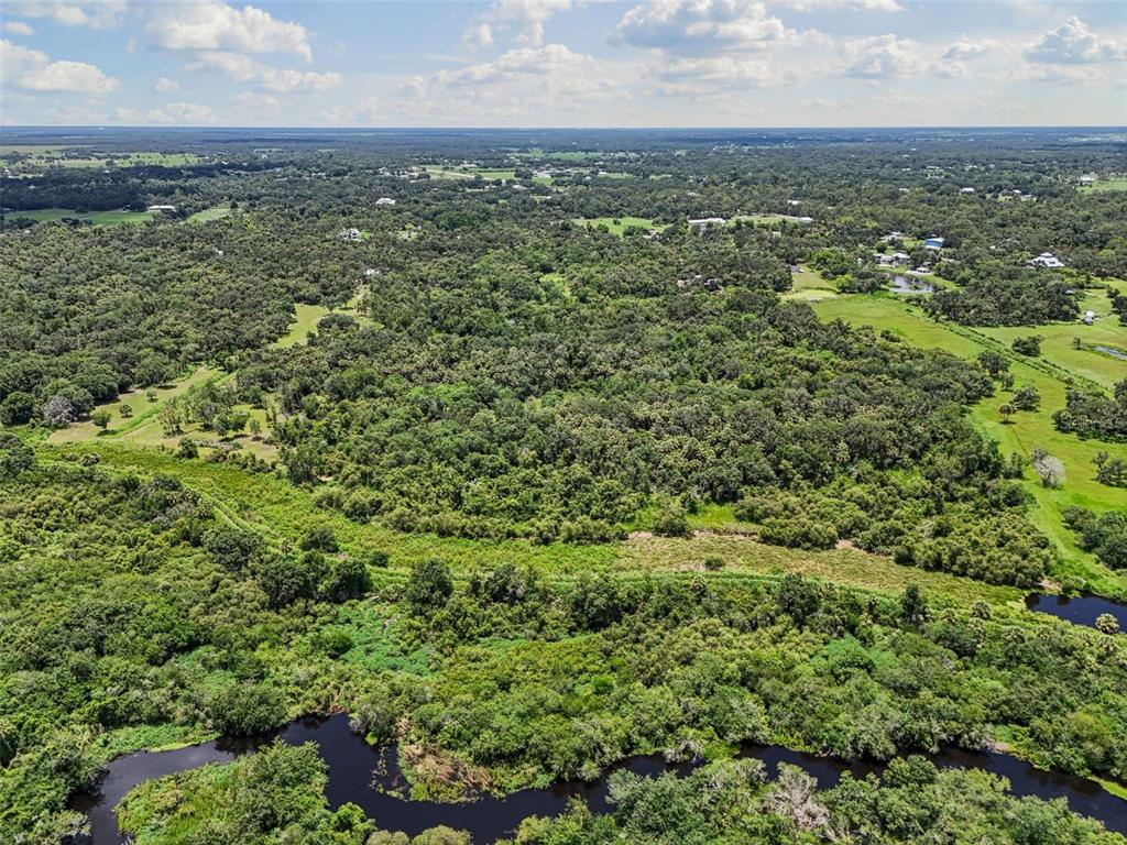 0 Hidden River Road Sarasota, FL 34240 - Photo 9 of 18 an aerial view of residential houses with outdoor space and trees