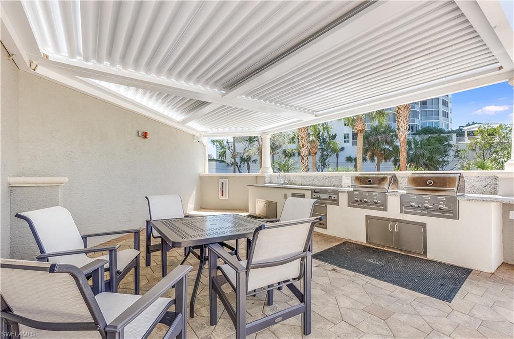 275 Indies Way, Unit 1002 Naples, FL 34110 - Photo 34 of 48 Dunes outside bbq area