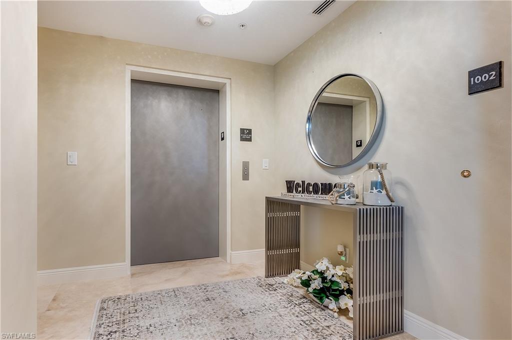 275 Indies Way, Unit 1002 Naples, FL 34110 - Photo 9 of 48 Private elevator and foyer into unit